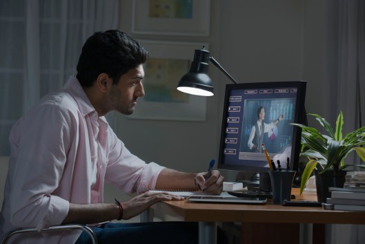 Businessman working at desk at home